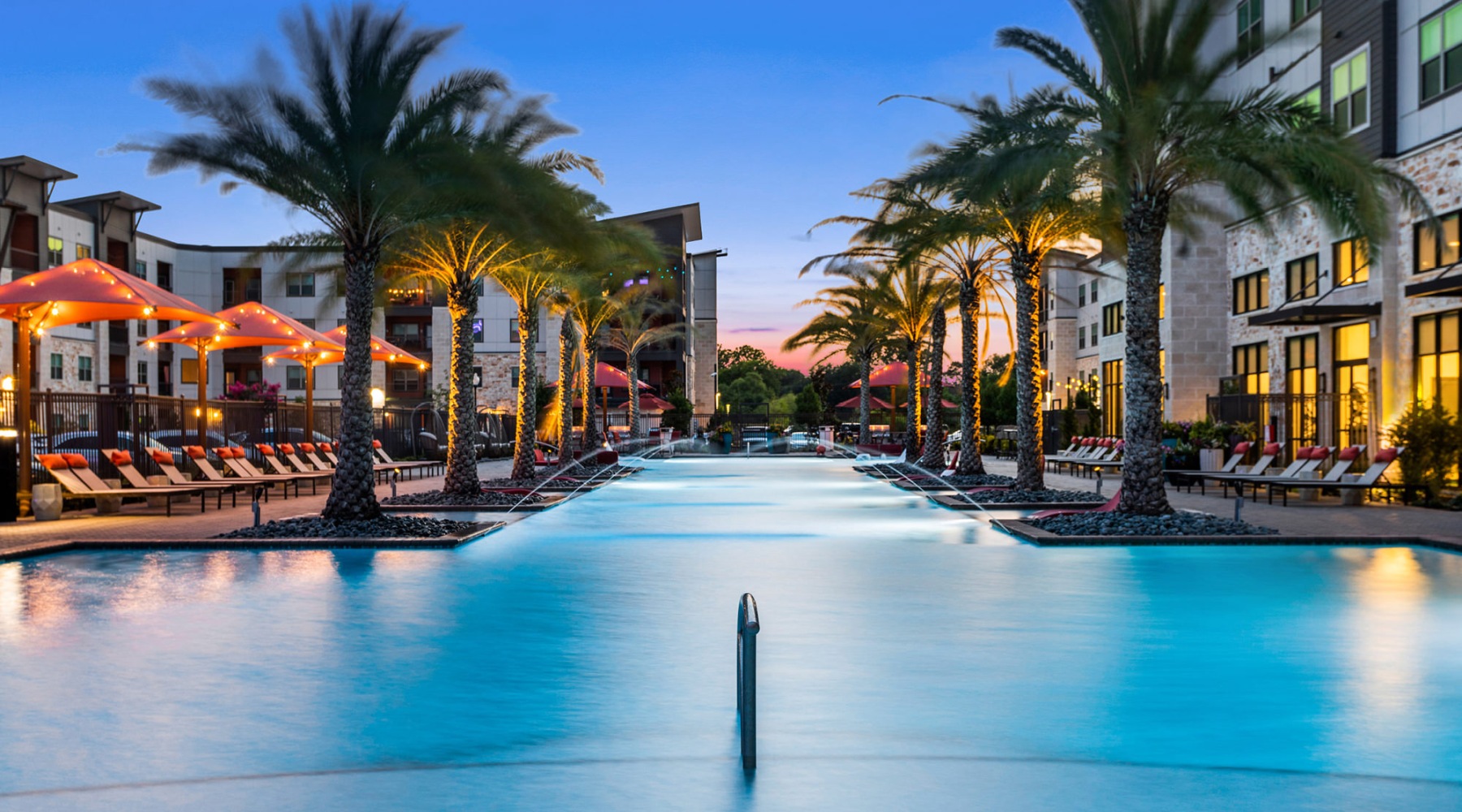 Resort-style swimming pool with lounge seating